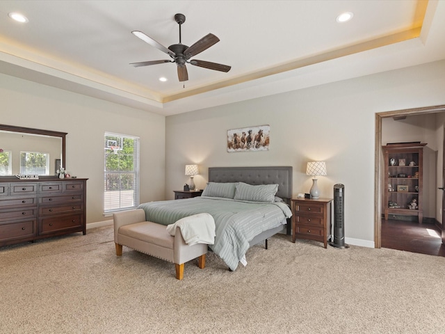 141 County Road 3481, Paradise, TX 76073 - carpeted bedroom featuring a tray ceiling, baseboards, ceiling fan, and recessed lighting