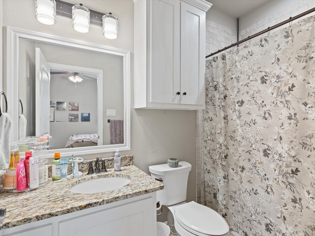 141 County Road 3481, Paradise, TX 76073 - bathroom with a shower with shower curtain, toilet, vanity, and ensuite bathroom
