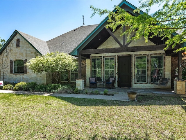 141 County Road 3481, Paradise, TX 76073 - view of front of house featuring roof with shingles, stone siding, and a front yard