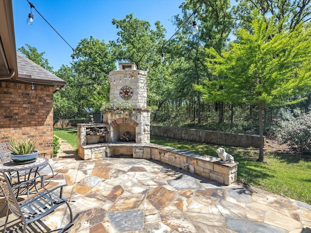 141 County Road 3481, Paradise, TX 76073 - view of patio / terrace featuring an outdoor stone fireplace