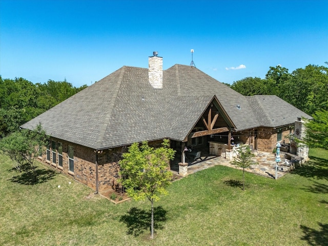141 County Road 3481, Paradise, TX 76073 - rear view of house featuring a patio area, a lawn, and brick siding