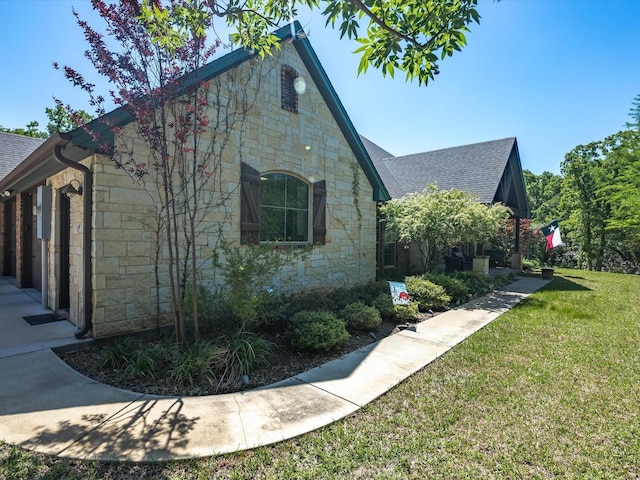 141 County Road 3481, Paradise, TX 76073 - view of home's exterior featuring a yard, stone siding, and a shingled roof