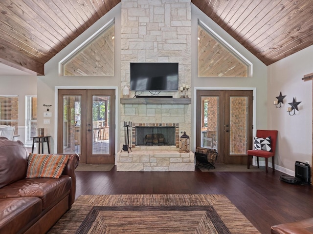 141 County Road 3481, Paradise, TX 76073 - living area with french doors, baseboards, wooden ceiling, a stone fireplace, and wood-type flooring