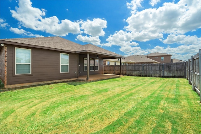 1037 Doe Meadow Dr, Fort Worth, TX 76028 - back of property featuring a lawn, ceiling fan, a fenced backyard, and a patio area