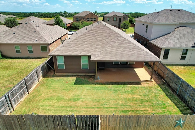 1037 Doe Meadow Dr, Fort Worth, TX 76028 - rear view of house with a fenced backyard, a shingled roof, a yard, and a patio