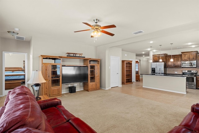 1037 Doe Meadow Dr, Fort Worth, TX 76028 - living area with light carpet, baseboards, ceiling fan, and visible vents