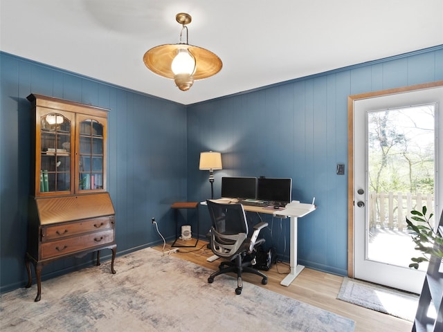 office featuring a wealth of natural light, wood finished floors, and baseboards