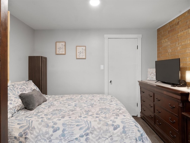 bedroom featuring dark colored carpet