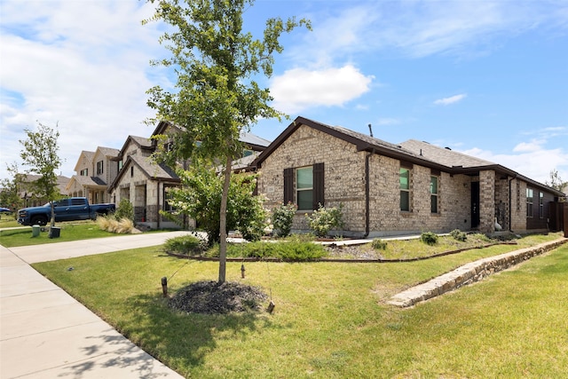 816 Adair Dr, Aubrey, TX 76227 - view of front of property with driveway, a front yard, and brick siding