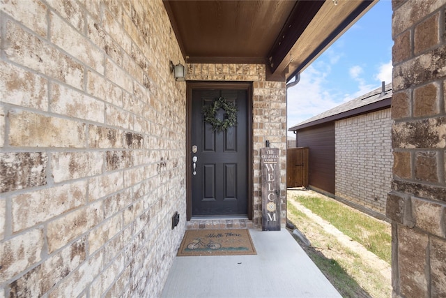 816 Adair Dr, Aubrey, TX 76227 - view of exterior entry featuring brick siding