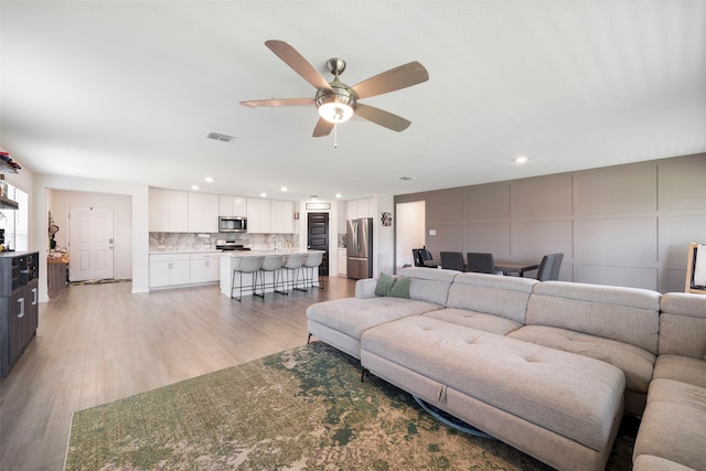 816 Adair Dr, Aubrey, TX 76227 - living room featuring recessed lighting, light wood finished floors, visible vents, and a ceiling fan