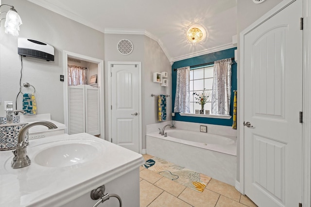 full bath with tile patterned floors, vanity, ornamental molding, and a garden tub