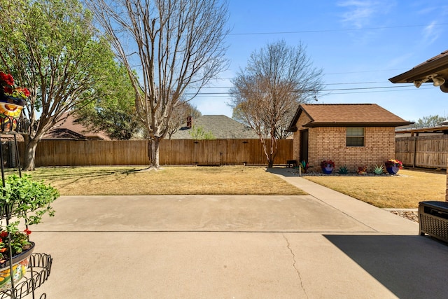 view of patio / terrace with a fenced backyard and an outdoor structure