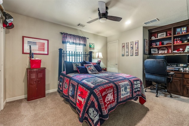 carpeted bedroom featuring baseboards, a ceiling fan, and visible vents