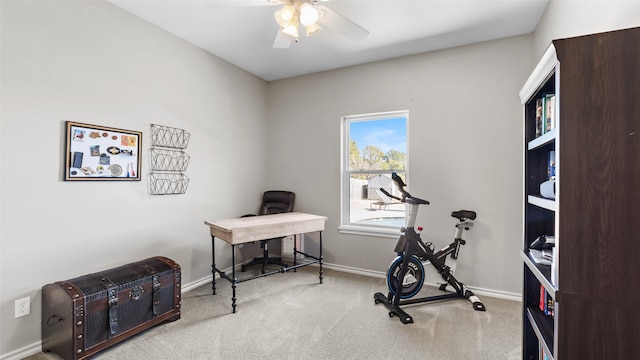workout room with baseboards, carpet floors, and ceiling fan