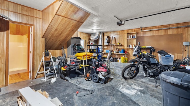 garage with a garage door opener and wooden walls