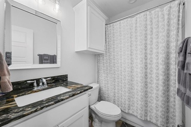 3025 S College Blvd, Denison, TX 75020 - bathroom with toilet, vanity, and shower / bath combo with shower curtain