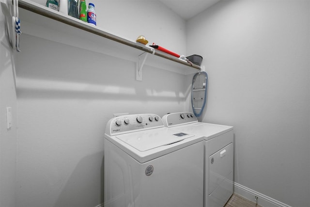 3025 S College Blvd, Denison, TX 75020 - laundry area with washing machine and clothes dryer, baseboards, laundry area, and wood finished floors