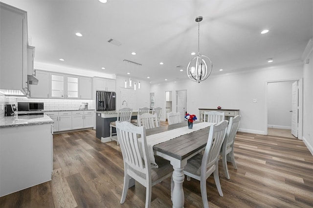 3025 S College Blvd, Denison, TX 75020 - dining room featuring visible vents, baseboards, recessed lighting, dark wood-type flooring, and an inviting chandelier