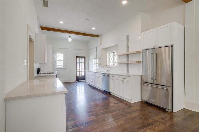 kitchen with open shelves, stainless steel appliances, a sink, dark wood-style floors, and visible vents
