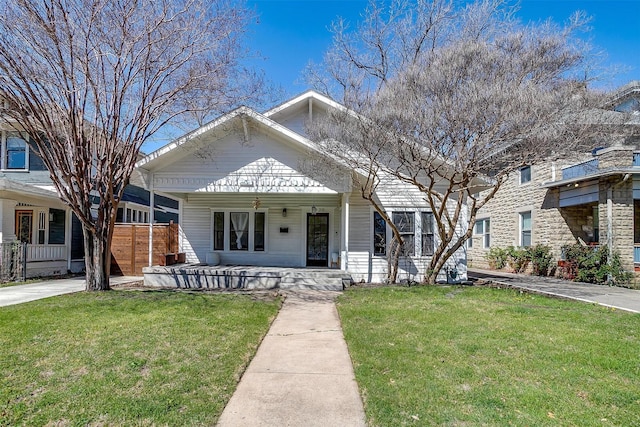 view of front facade with a front yard and a porch
