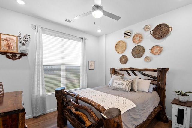 bedroom featuring visible vents, baseboards, ceiling fan, wood finished floors, and recessed lighting