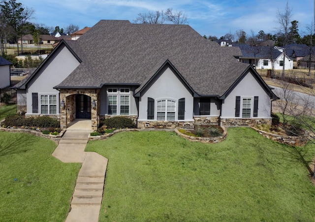 7603 Timber Trl, Tyler, TX 75703 - french country style house featuring stone siding, stucco siding, and a shingled roof