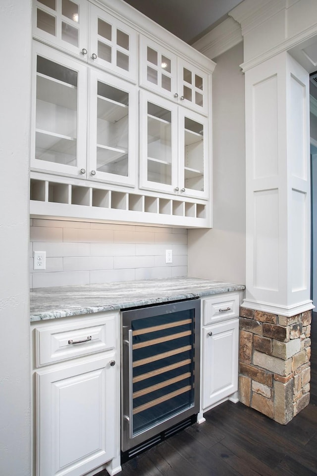 7603 Timber Trl, Tyler, TX 75703 - indoor dry bar featuring wine cooler, dark wood-type flooring, and decorative backsplash