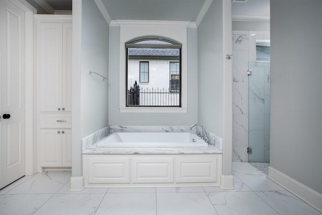 7603 Timber Trl, Tyler, TX 75703 - full bathroom with marble finish flooring, a bath, a marble finish shower, ornamental molding, and baseboards
