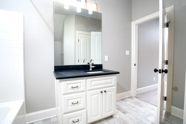 7603 Timber Trl, Tyler, TX 75703 - bathroom with vanity, wood finished floors, and baseboards