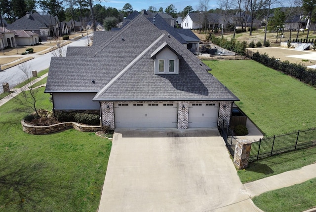 7603 Timber Trl, Tyler, TX 75703 - view of front of house featuring roof with shingles, brick siding, driveway, and a residential view