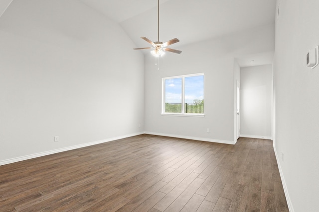 empty room featuring baseboards, a ceiling fan, and dark wood-style flooring