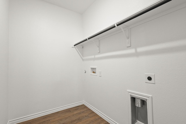 laundry room featuring hookup for an electric dryer, dark wood-style flooring, hookup for a washing machine, gas dryer hookup, and laundry area