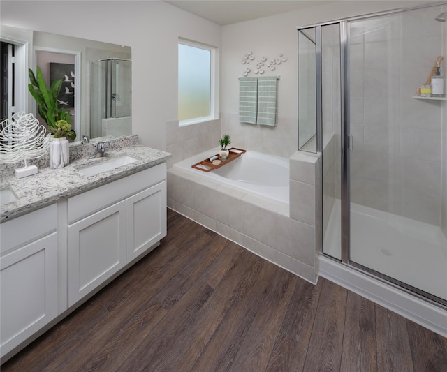 5021 Cervinae Rd, Fort Worth, TX 76036 - bathroom featuring a shower stall, a bath, wood finished floors, and vanity