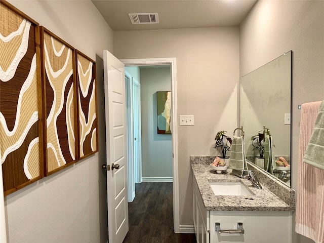 5021 Cervinae Rd, Fort Worth, TX 76036 - bathroom featuring wood finished floors, vanity, and baseboards