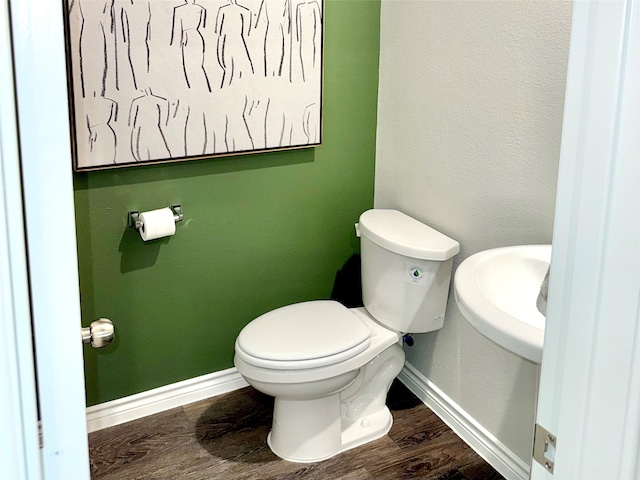 5021 Cervinae Rd, Fort Worth, TX 76036 - bathroom featuring baseboards, toilet, wood finished floors, and a sink
