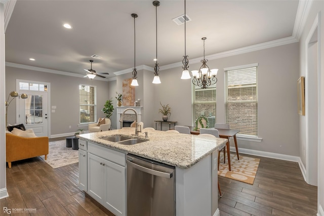 918 Hackberry Dr, Bossier City, LA 71111 - kitchen featuring stainless steel dishwasher, a sink, baseboards, dark wood-style flooring, and recessed lighting