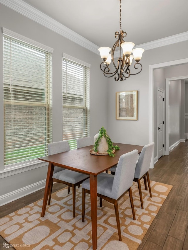 918 Hackberry Dr, Bossier City, LA 71111 - dining space with ornamental molding, a chandelier, wood finished floors, and baseboards
