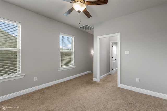918 Hackberry Dr, Bossier City, LA 71111 - unfurnished bedroom featuring light colored carpet, baseboards, and ceiling fan