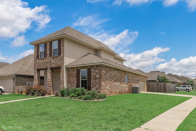 918 Hackberry Dr, Bossier City, LA 71111 - view of home's exterior with brick siding, a garage, driveway, and central air condition unit
