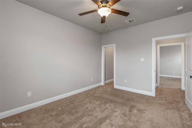 918 Hackberry Dr, Bossier City, LA 71111 - unfurnished bedroom featuring carpet, baseboards, and ceiling fan