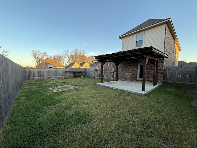 yard at dusk featuring a pergola, a fenced backyard, and a patio
