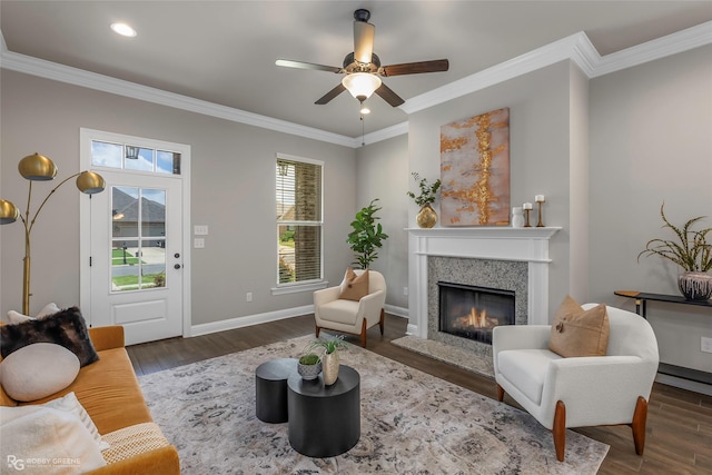 918 Hackberry Dr, Bossier City, LA 71111 - living area with a premium fireplace, wood finished floors, crown molding, a ceiling fan, and baseboards