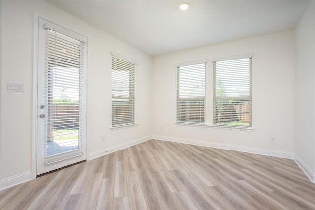 406 Eaton Dr, Justin, TX 76247 - spare room featuring light wood finished floors and baseboards