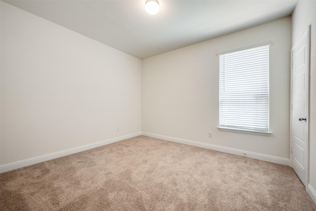 406 Eaton Dr, Justin, TX 76247 - spare room featuring a healthy amount of sunlight, carpet flooring, and baseboards