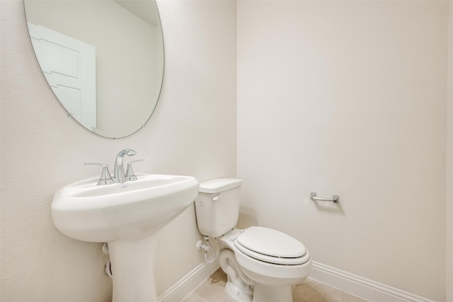406 Eaton Dr, Justin, TX 76247 - bathroom featuring tile patterned floors, baseboards, and toilet