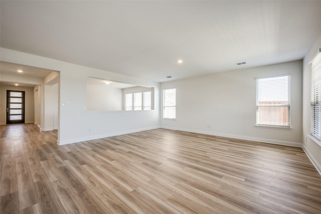 406 Eaton Dr, Justin, TX 76247 - unfurnished living room featuring baseboards, light wood finished floors, visible vents, and recessed lighting