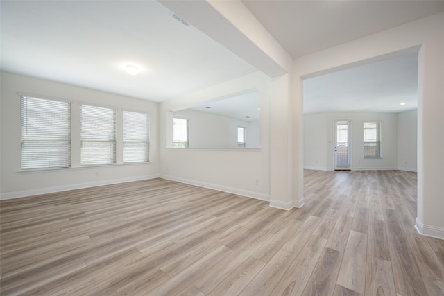 406 Eaton Dr, Justin, TX 76247 - spare room featuring light wood-type flooring, baseboards, and visible vents