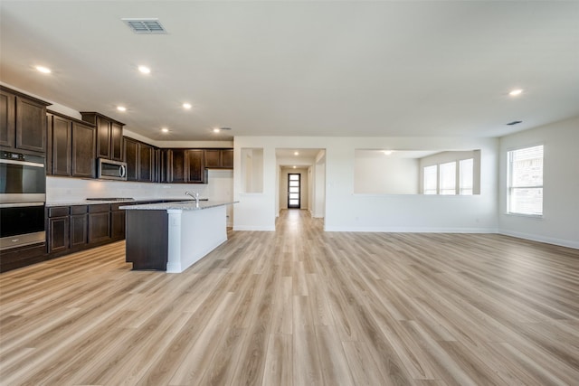 406 Eaton Dr, Justin, TX 76247 - kitchen with baseboards, visible vents, a sink, and appliances with stainless steel finishes