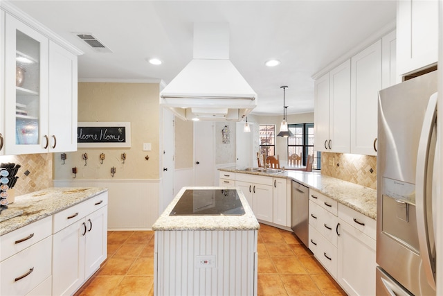 kitchen featuring appliances with stainless steel finishes, a center island, white cabinets, glass insert cabinets, and custom range hood